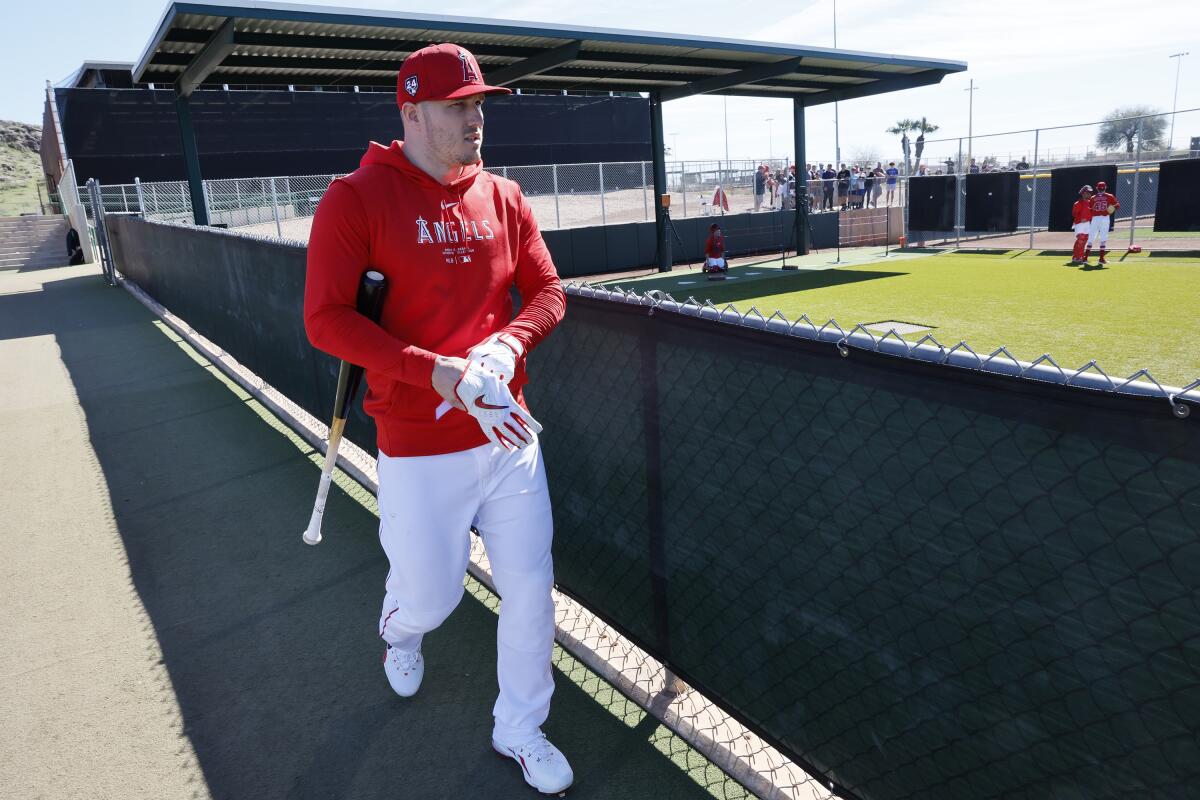 Mike Trout makes his way to batting practice at Angels spring training in Tempe, Ariz., on Monday.