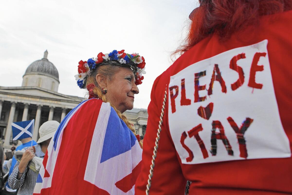 Pro-union supporters opposing Scottish independence look on during a rally in Trafalgar Square in London on Monday.