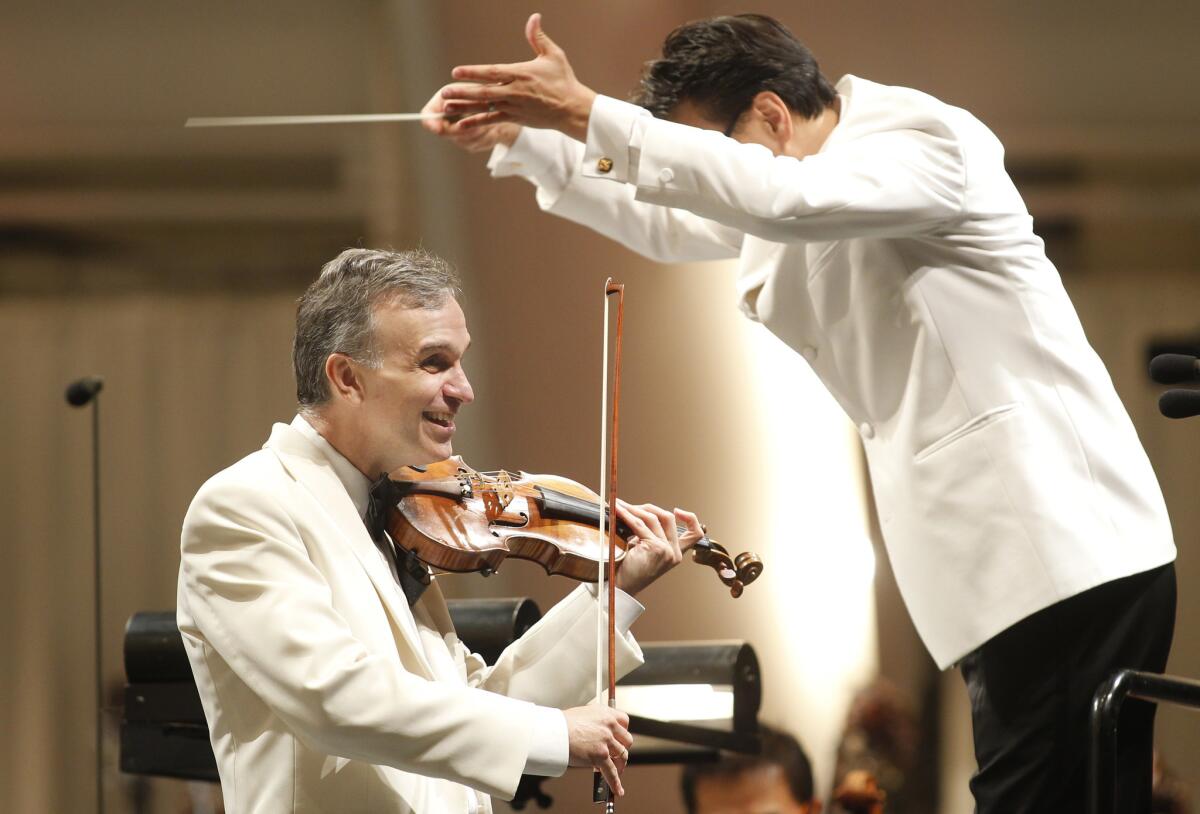 Soloist Gil Shaham and conductor Ken-David Masur perform at the Hollywood Bowl on Tuesday, Aug. 23, 2016.