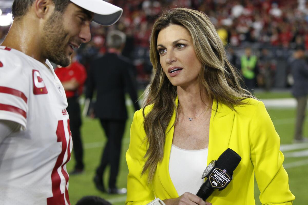 Fox sideline reporter Erin Andrews speaks with San Francisco 49ers quarterback Jimmy Garoppolo after a game against the Arizona Cardinals on Oct. 31 in Glendale, Ariz.