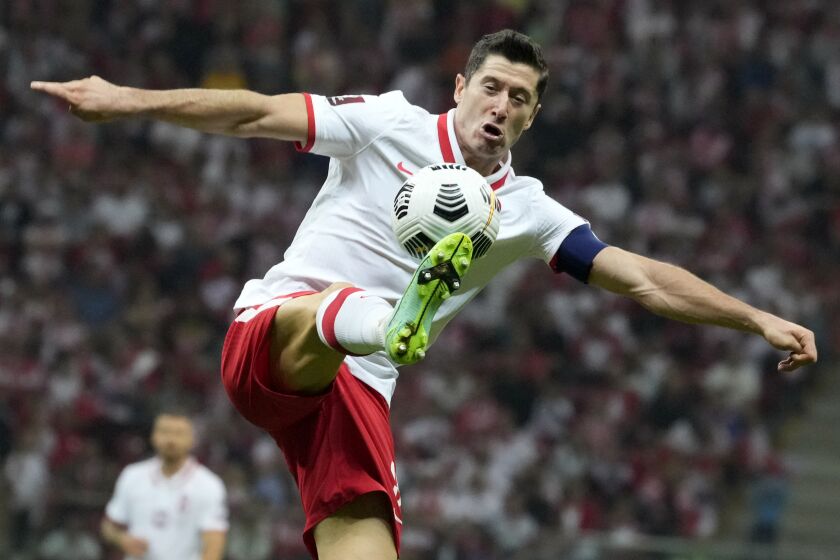 FILE Poland's Robert Lewandowski controls the ball during the World Cup 2022 group I qualifying soccer match.