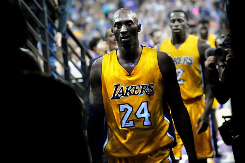 Kobe Bryant walks off the court to the locker room at halftime of a 118-115 loss to the Kings at Sleep Train Arena.