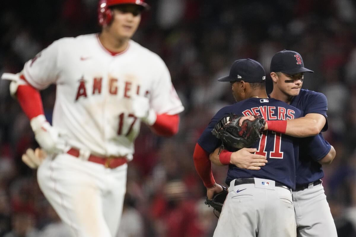 Red Sox third baseman Rafael Devers and first baseman Bobby Dalbec celebrate.