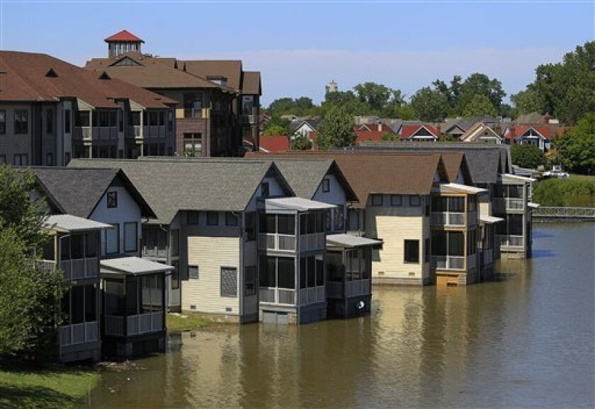 Homes on Mud Island that are usually high above the water level are met by the rising waters of the Mississippi River in Memphis, Tenn., on Wednesday, May 4, 2011. The National Weather Service is predicting a 48-foot crest of the Mississippi River on May 11. (AP Photo/Lance Murphey)