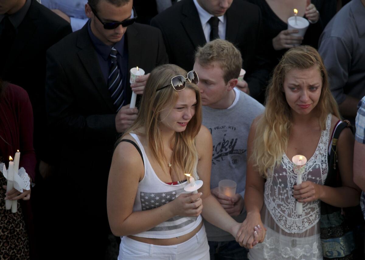 Hundreds turned out Saturday for a vigil at UC Santa Barbara to remember the victims killed in Friday's rampage.