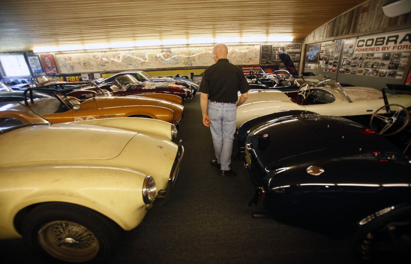 Lynn Park with his garage full of Cobra cars. Known in classic car circles as Mr. Cobra, Park has been collecting the marque since he bought his first after getting out of the Army in 1969. The first purchase got him hooked.