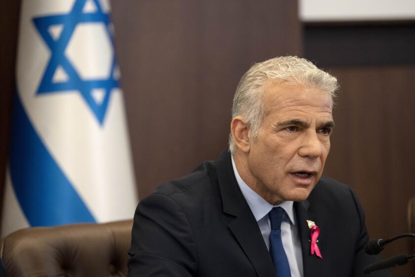 FILE - Israeli Prime Minister Yair Lapid makes an opening statement as he chairs the weekly cabinet meeting in Jerusalem, Oct. 2, 2022. Israel’s prime minister said Tuesday, Oct. 11, that the country has reached an “historic agreement” with neighboring Lebanon over their shared maritime border after months of U.S.-brokered negotiations.(AP Photo/Maya Alleruzzo, File)