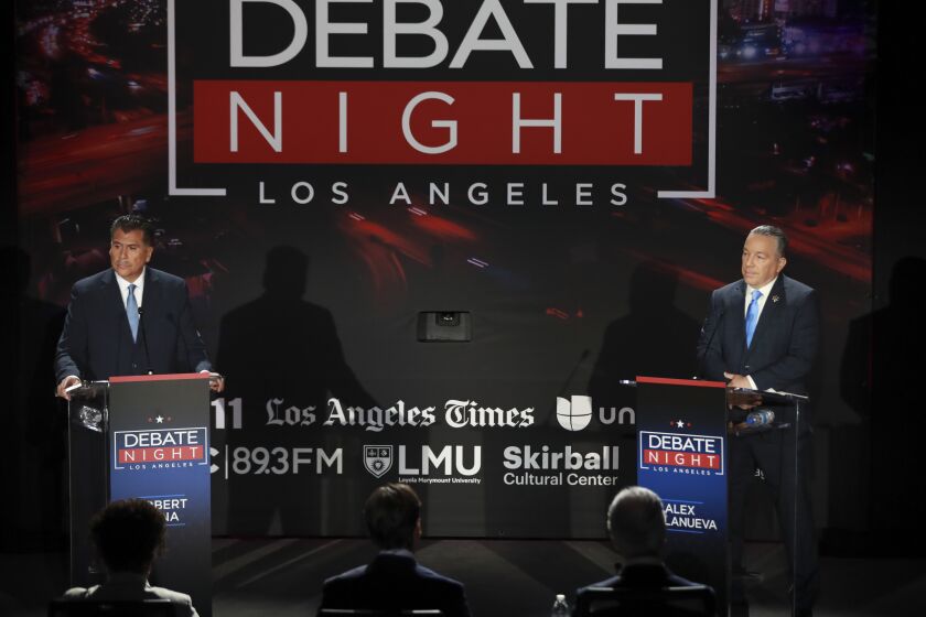 Los Angeles, CA - September 21: Retired Long Beach Police Chief Robert Luna, left, and Los Angeles Sheriff Alex Villanueva debate during the Los Angeles County Sheriff debate ahead of the Nov. 8 general election at the Skirball Cultural Center in Los Angeles, {on {wdat}. The Los Angeles Times, Fox 11 LA, Univision 34, KPCC, the Skirball Cultural Center, the Los Angeles Urban League and Loyola Marymount University co-host back-to-back debates with the leading candidates in the L.A. mayoral and L.A. County Sheriff races. The mayoral debate will feature top candidates Rep. Karen Bass and developer Rick Caruso; the Los Angeles County Sheriff debate will include Sheriff Alex Villanueva and retired Long Beach Police Chief Robert Luna. The evening aims to be informative for Angelenos ahead of the Nov. 8 general election, which will include the runoff for the next mayor and sheriff. The debates will be co-moderated by Times Columnist Erika D. Smith and Fox 11 News Anchor Elex Michaelson. Additionally, Univision morning news anchor Gabriela Teissier will join the moderators during the mayoral debate, and Univision evening news anchor Oswaldo Borraez will join the moderators during the sheriff candidates debate. KPCC criminal justice correspondent Frank Stoltze will contribute as well. (Allen J. Schaben / Los Angeles Times)