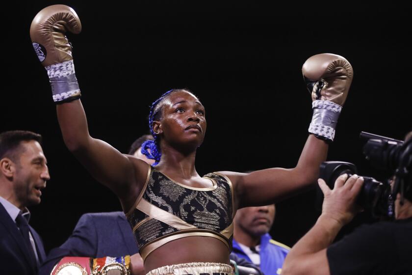 Claressa Shields stands for her introduction for her 154-pound title fight with Ivana Habazin on Jan. 10, 2020.