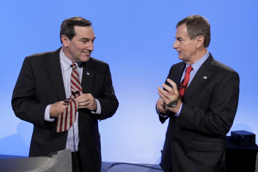 Indiana Senate candidates Democrat Joe Donnelly, left, and Republican Richard Mourdock talk after participating in a debate in Indianapolis.