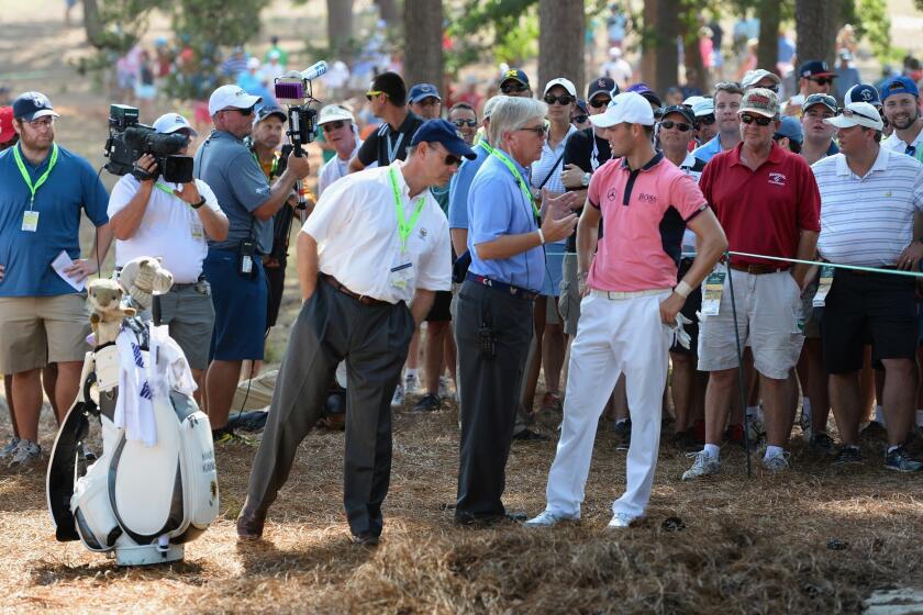 Martin Kaymer, right, discusses his options with USGA executive director Mike Davis, left, and president, Thomas O'Toole Jr. on the fourth hole Saturday during the third round of the U.S. Open at Pinehurst.