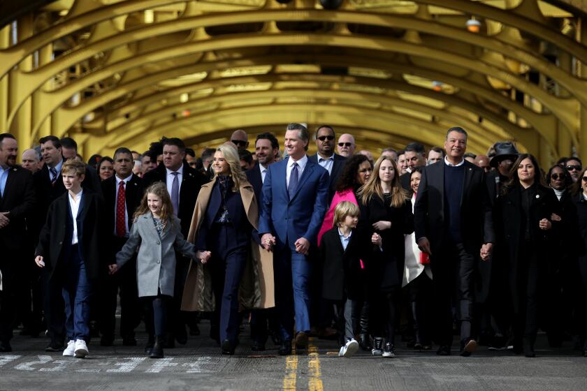 SACRAMENTO, CA - JANUARY 06: Governor Gavin Newsom in People's March on Tower Bridge during inauguration ceremony for a second term in downtown on Friday, Jan. 6, 2023 in Sacramento, CA. (Gary Coronado / Los Angeles Times)