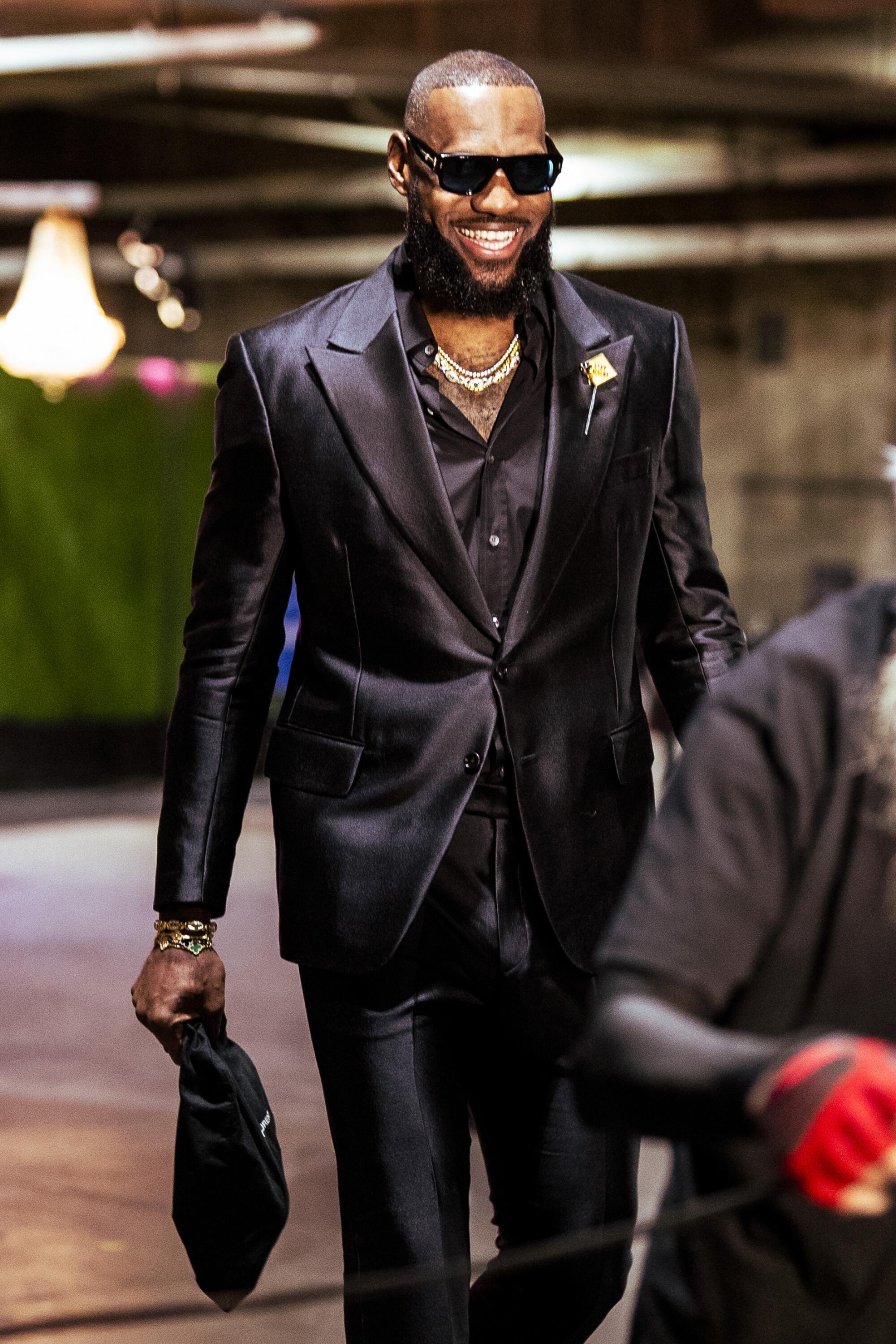 LeBron James arrives at Crypto.com Arena in a black suit for the Lakers' game Tuesday night against the Thunder.