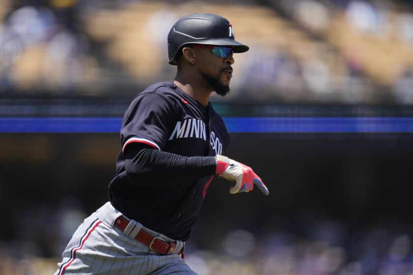 Minnesota Twins designated hitter Byron Buxton (25) celebrates after hitting a home run during the fourth inning of a baseball game against the Los Angeles Dodgers in Los Angeles, Wednesday, May 17, 2023. (AP Photo/Ashley Landis)