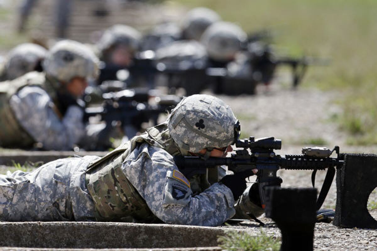 Female soldiers from the 1st Brigade Combat Team, 101st Airborne Division, train on a firing range at Fort Campbell, Ky.