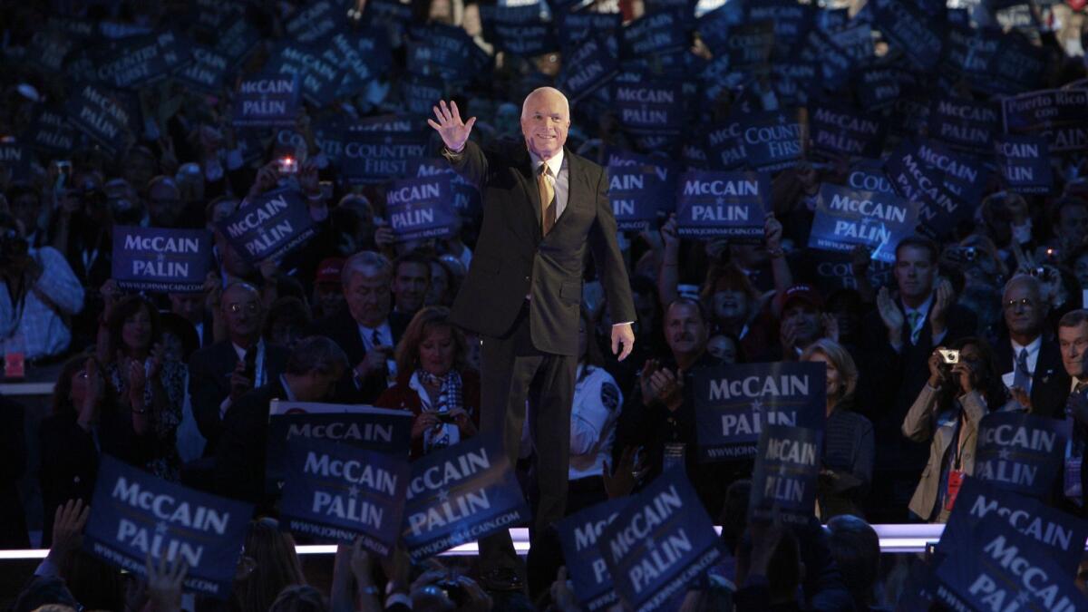 Republican presidential candidate John McCain acknowledges the crowed as he goes on stage at the Republican National Convention in St. Paul, Minn., in 2008.