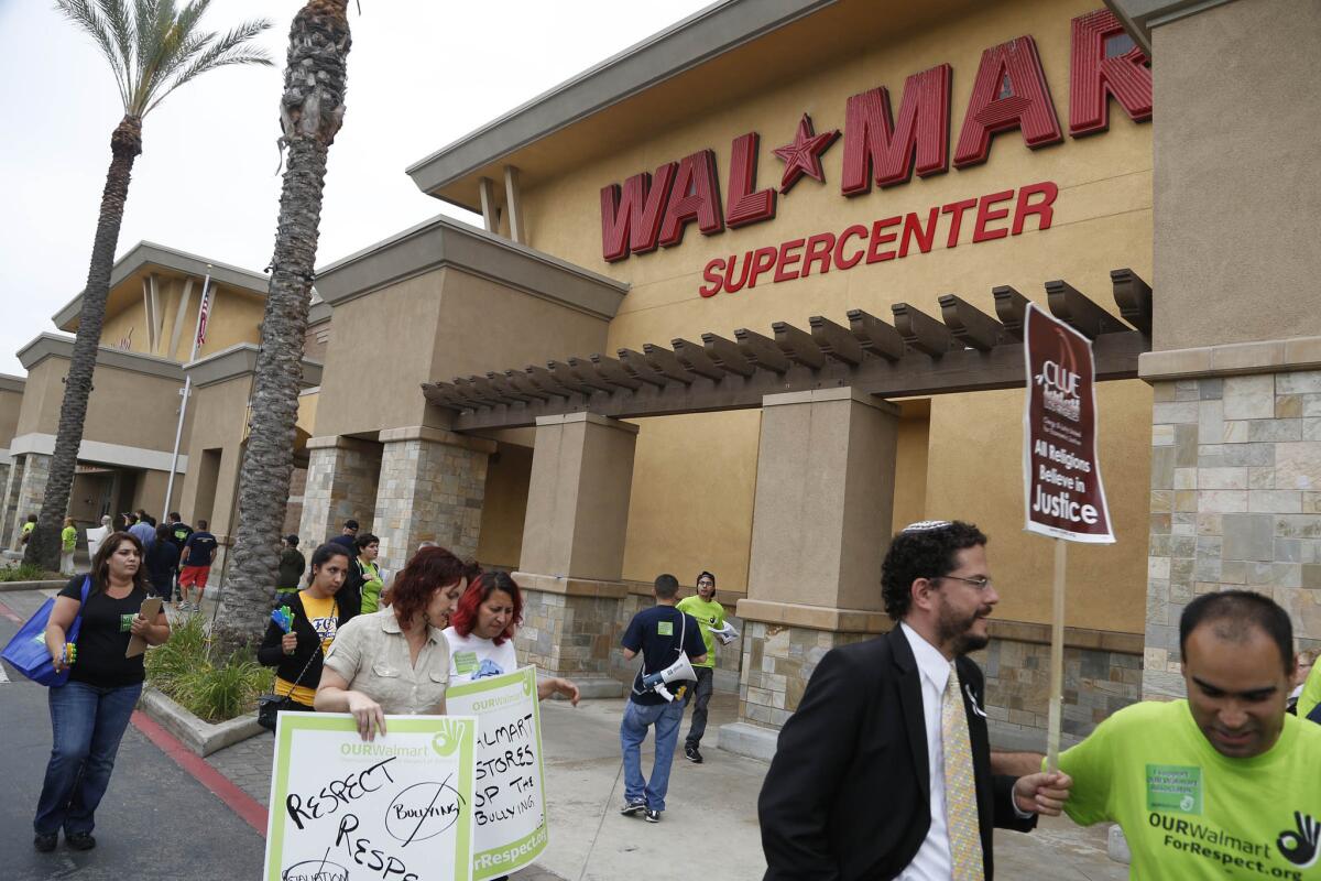 Wal-Mart workers demonstrate in 2013 outside the Pico Rivera store for what they said was retaliation against employees for speaking out.