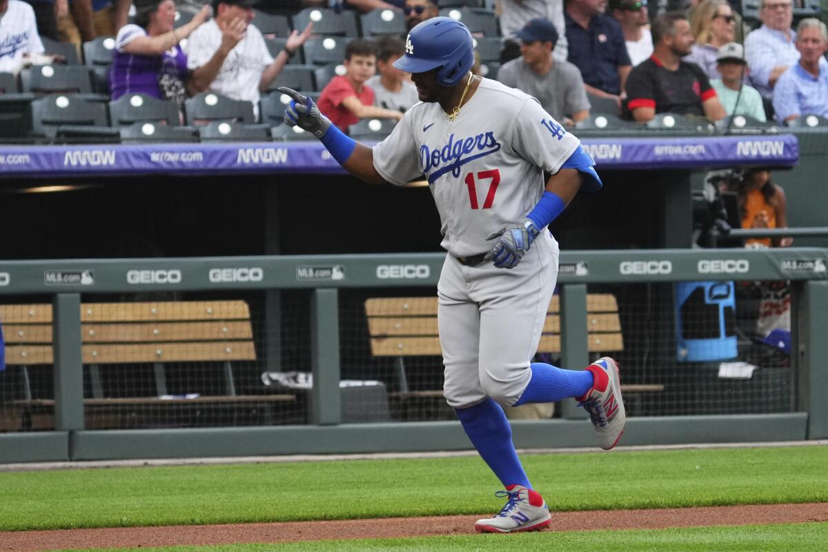 Dodgers second baseman Hanser Alberto celebrates after hitting a solo home run against the Colorado Rockies.