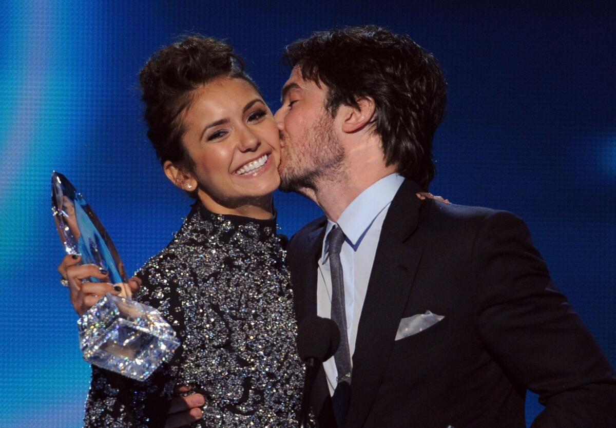 "The Vampire Diaries" actors Nina Dobrev and Ian Somerhalder accept their Favorite On Screen Chemistry award at The 40th Annual People's Choice Awards at Nokia Theatre L.A. Live in Los Angeles.