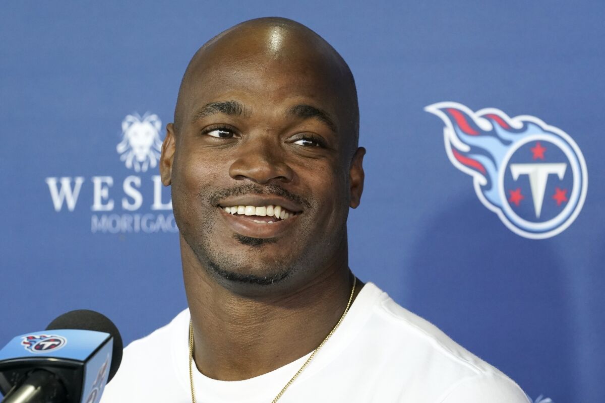 Tennessee Titans running back Adrian Peterson answers questions after an NFL football practice Friday, Nov. 5, 2021, in Nashville, Tenn. The Titans signed the 2012 NFL MVP and four-time All-Pro running back to help replace injured NFL rushing leader Derrick Henry. (AP Photo/Mark Humphrey)