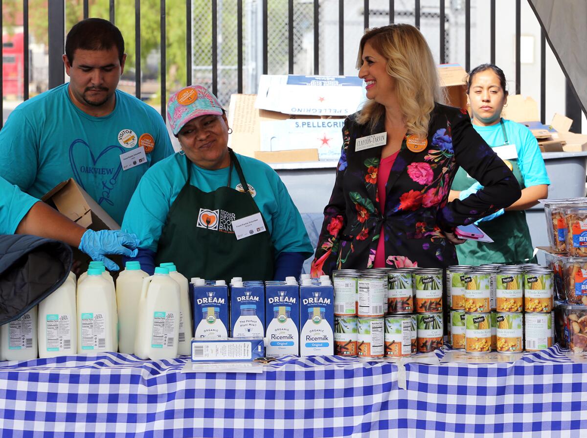 Ocean View School District Board of Trustees Clerk Gina Clayton-Tarvin talks with volunteers.