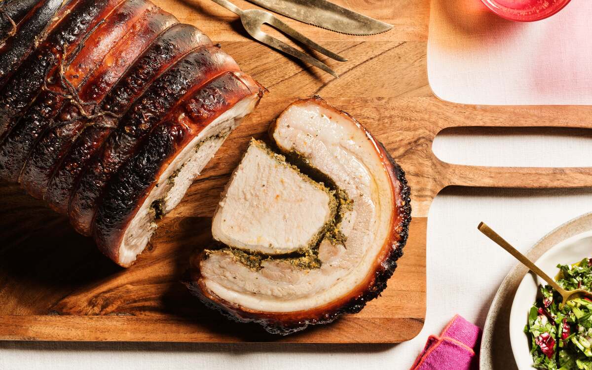 Packed with herbs, citrus zest and chile flakes, porchetta is an impressive main course for a large holiday dinner or party.