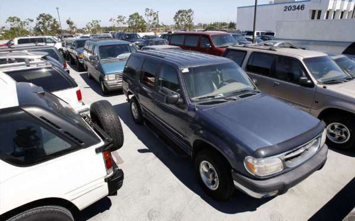 Older, gas guzzlers are lined up for scrapping as part of the popular "cash for clunkers" program at a lot in Torrance, Calif.