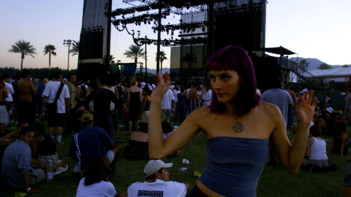 Melissa Bennett of Los Angeles dances at the first Coachella, in 1999.