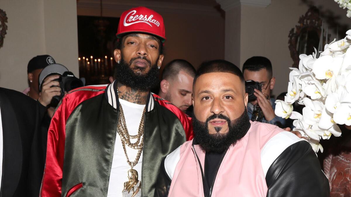Rapper Nipsey Hussle, left, and DJ Khaled attend a 2017 party in Beverly Hills.