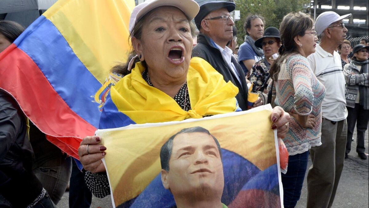 Supporters of former Ecuadorean President Rafael Correa protest outside the National Court of Justice in Quito in June after a judge linked Correa to the kidnapping of an opposition lawmaker.