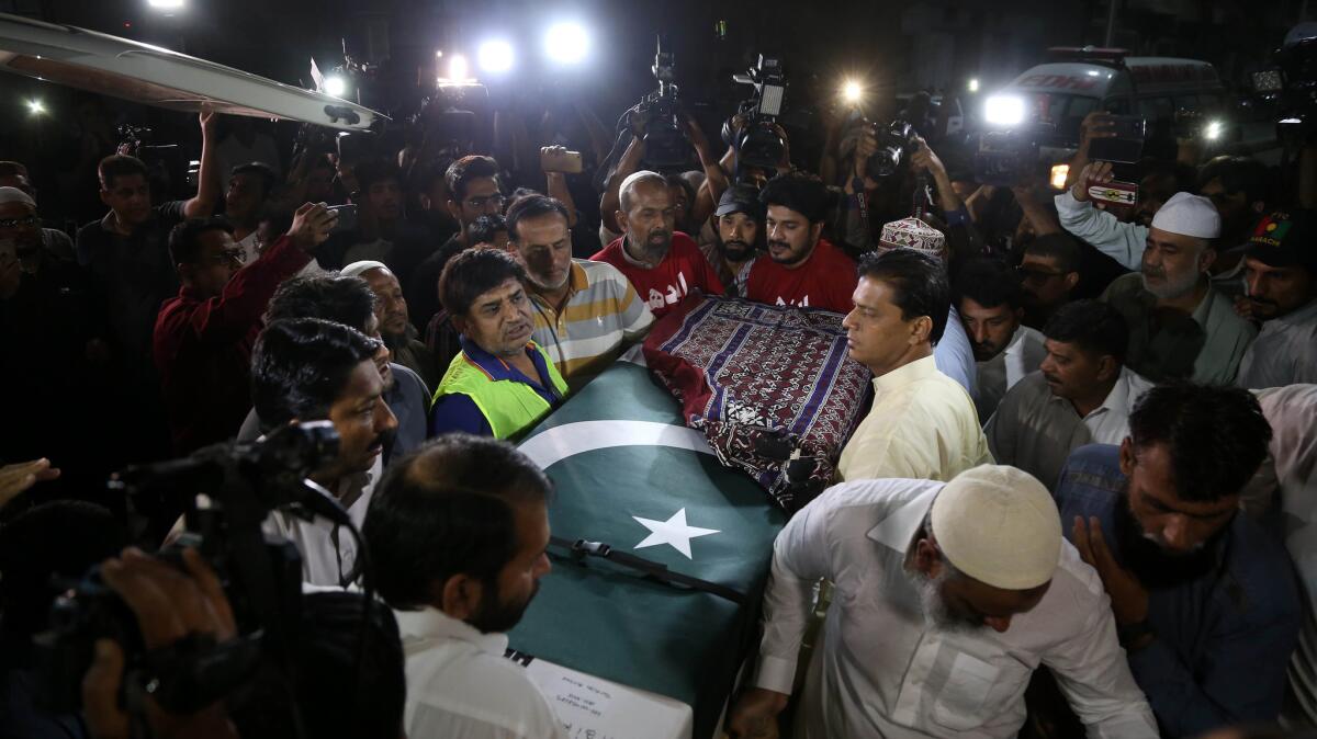 Relatives carry the coffin of Sabika Sheikh, an exchange student from Pakistan who was killed in the recent mass shooting at a Texas high school.