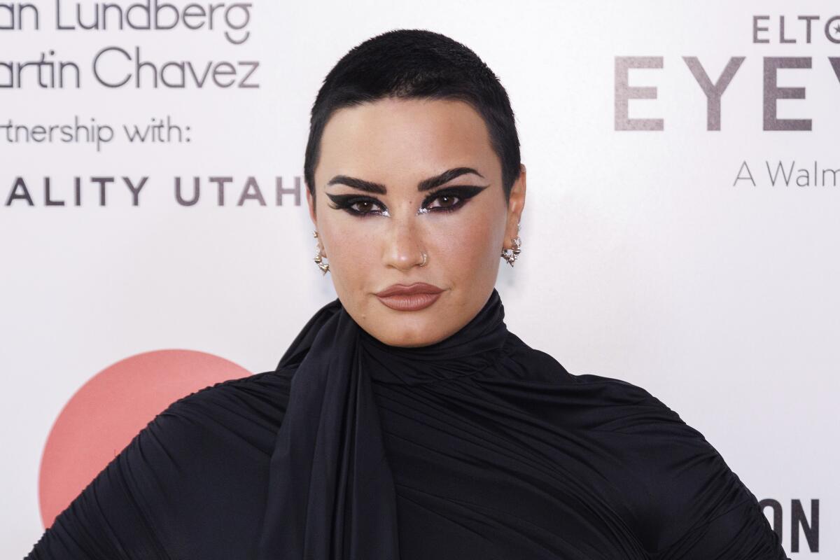 Demi Lovato arrives at Elton John's 2022 AIDS Foundation Academy Awards party.