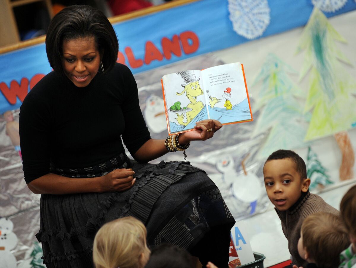 First Lady Michelle Obama reads the Dr. Seuss book "Green Eggs and Ham" to children 