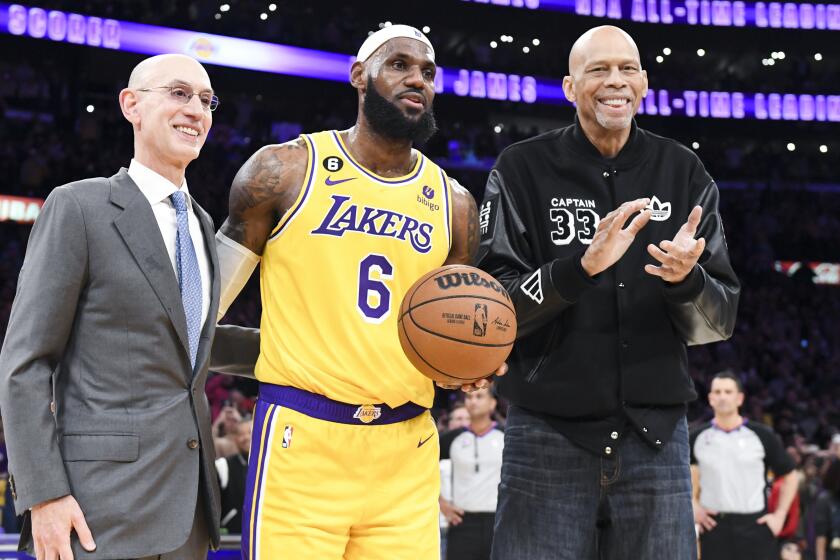 LOS ANGELES, CA - APRIL 29: Adam Silver, from left, poses with LeBron James and Kareem Abdul-Jabbar.