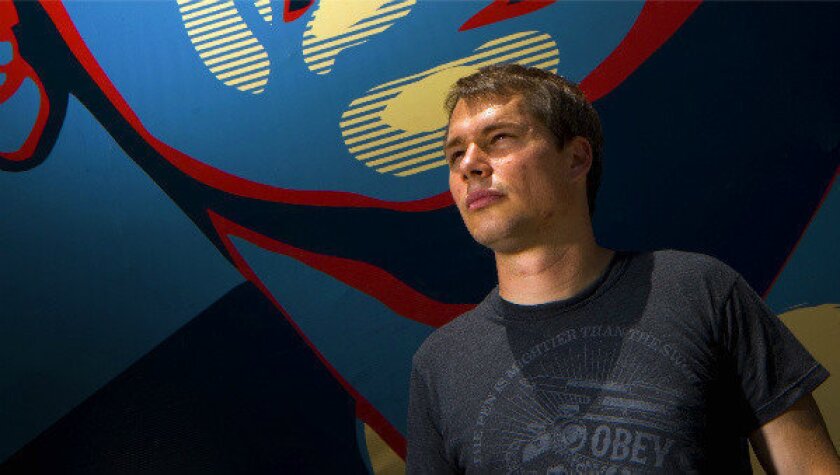 A 2008 photograph of Los Angeles street artist Shepard Fairey, in front of his mural depicting then Sen. Barack Obama.