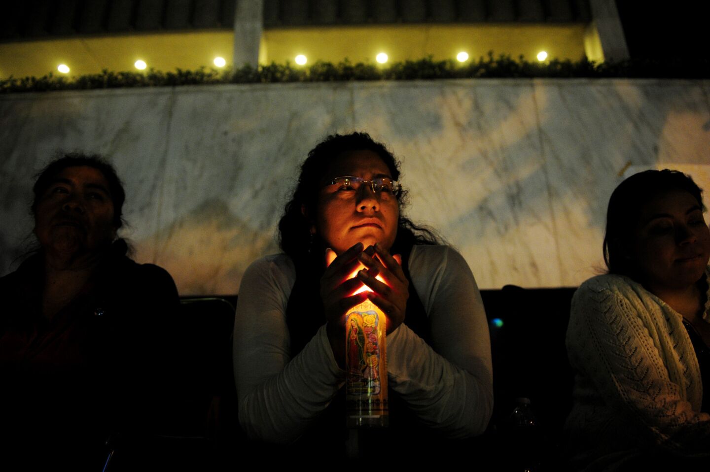 Mercedes Montano, an immigrant from Mexico living in U.S. without legal status, prays during a 24-hour vigil outside the Civil Center in downtown Los Angeles. Demonstrators called on Congress to pass immigration reform.