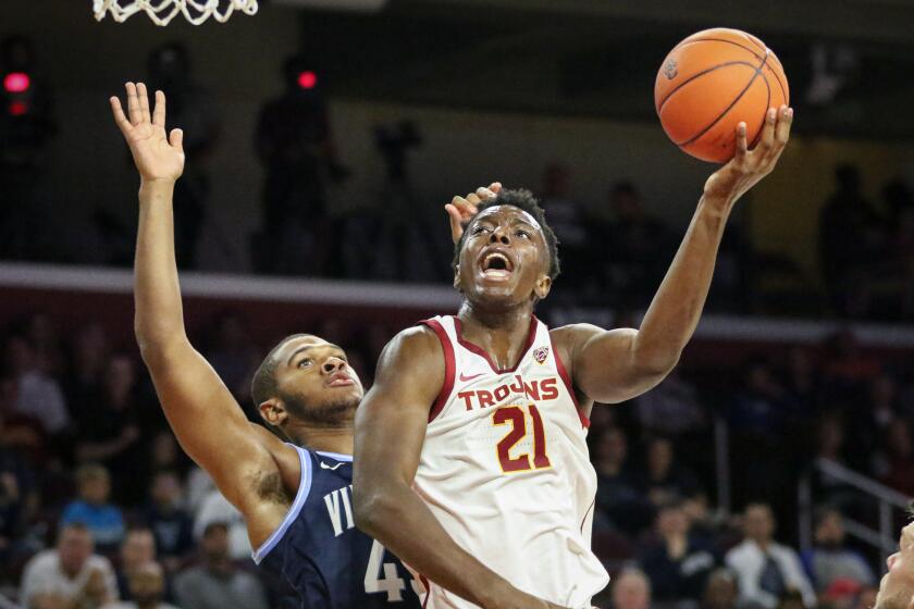 USC forward Onyeka Okongwu drives to the basket over Villanova forward Eric Dixon.