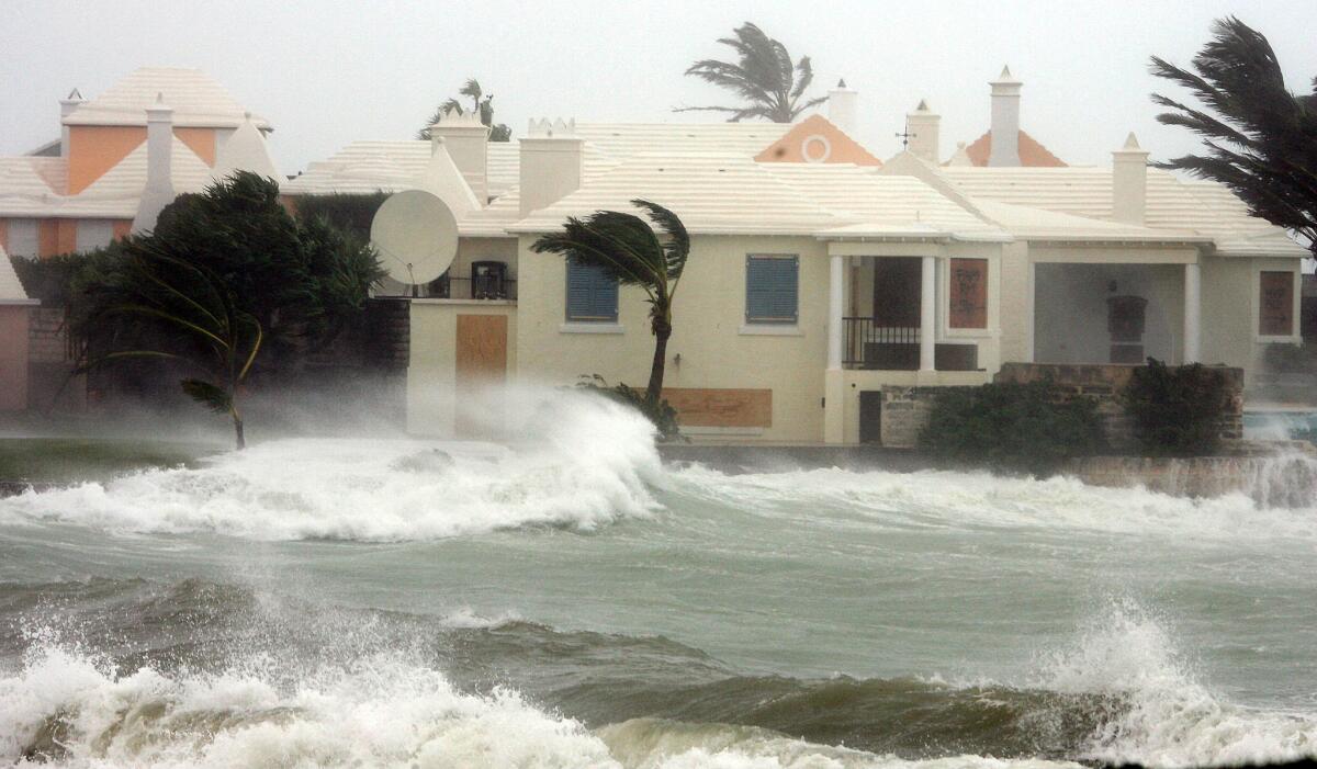High waves hit a house in Devonshire Bay in Bermuda as Hurricane Florence churns toward the U.S.