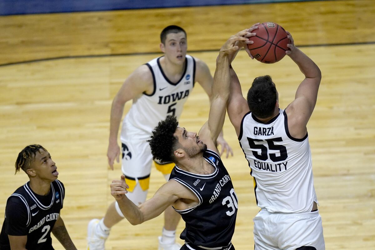 Grand Canyon and Iowa players battle for the ball.