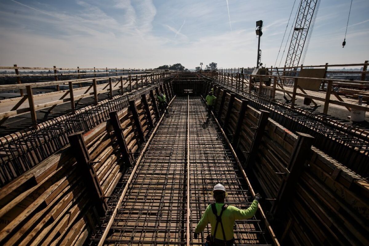 Crews work at a 3,700-foot-long viaduct that is being built for the high-speed rail line in Fresno.