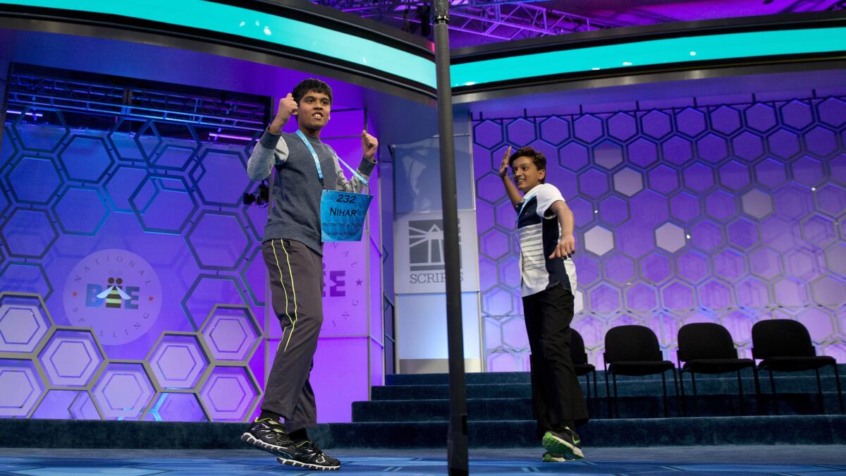 Nihar Janga, 11, left, of Austin, Texas, and Jairam Hathwar, 13, of Painted Post, N.Y., celebrate after being named co-champions in the 2016 National Spelling Bee.