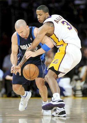 Lakers forward Trevor Ariza, who scored 26 points, steals the ball from Mavericks guard Jason Kidd in the first quarter Sunday.