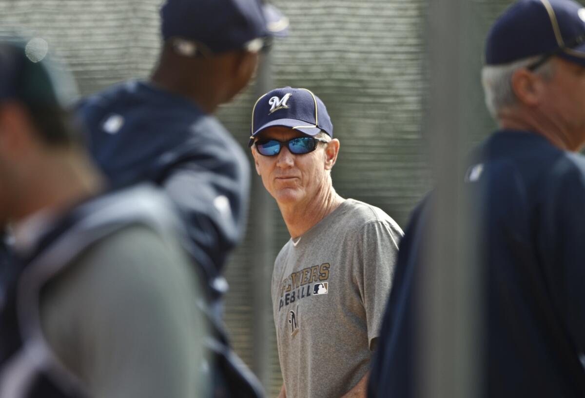 Ron Roenicke manages the Milwaukee Brewers during spring in 2011.