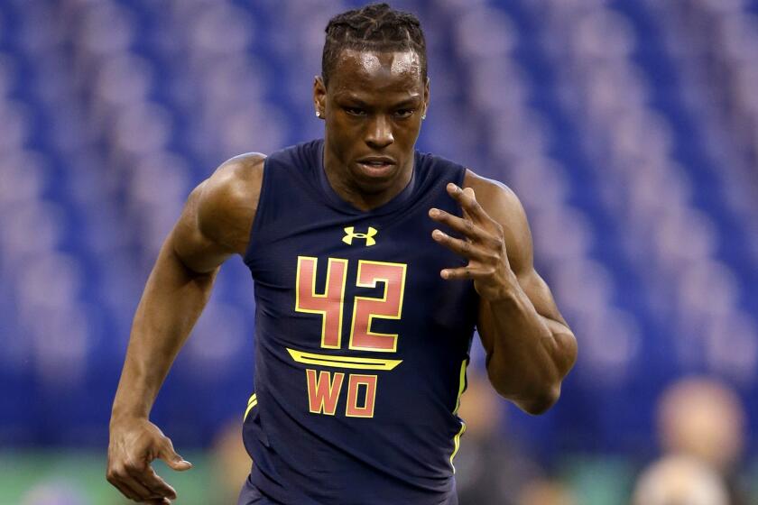 John Ross runs the 40-yard dash in 4.22 seconds Saturday to set a new record at the NFL scouting combine.