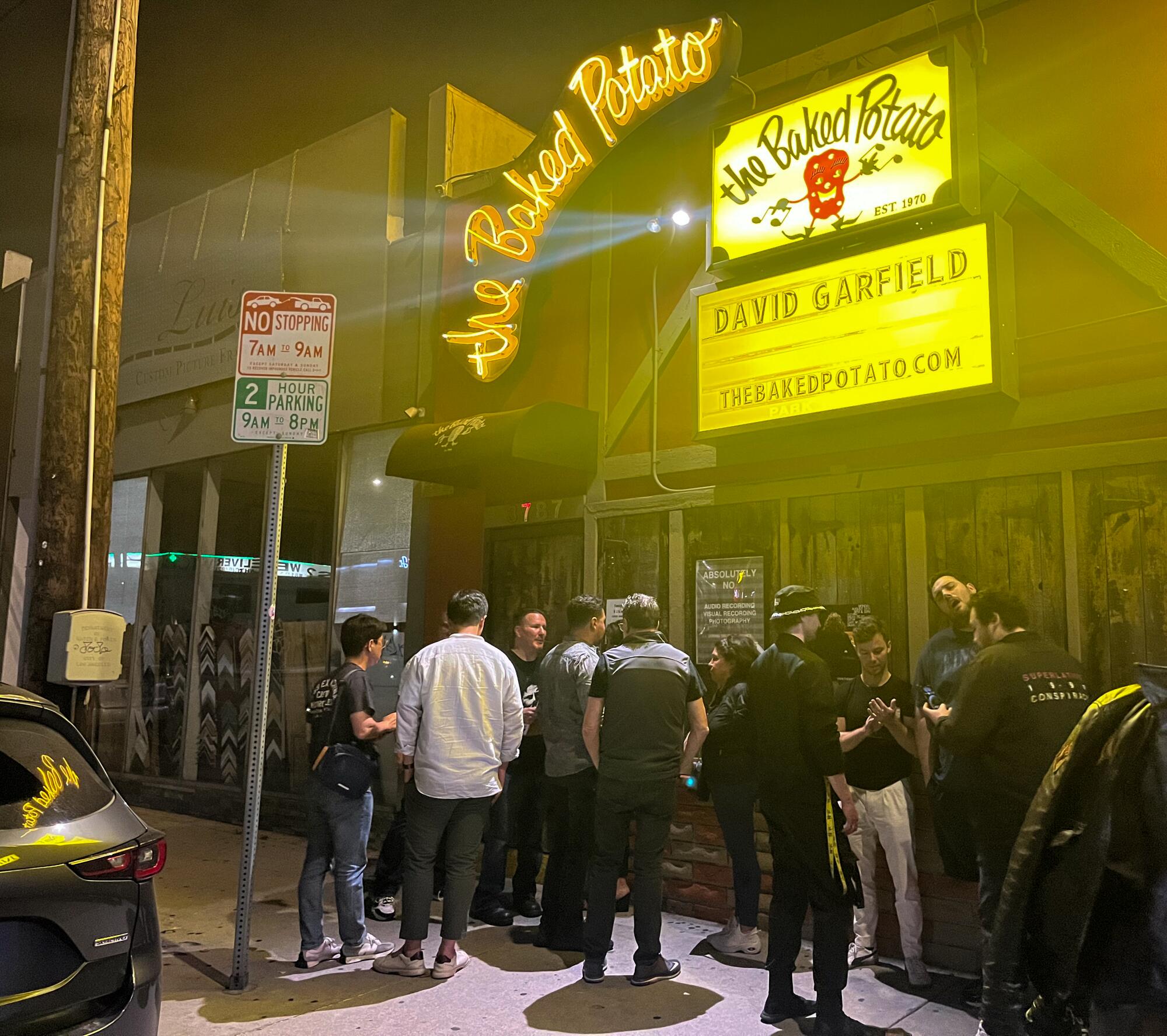 People standing outside the Baked Potato jazz club in Studio City.