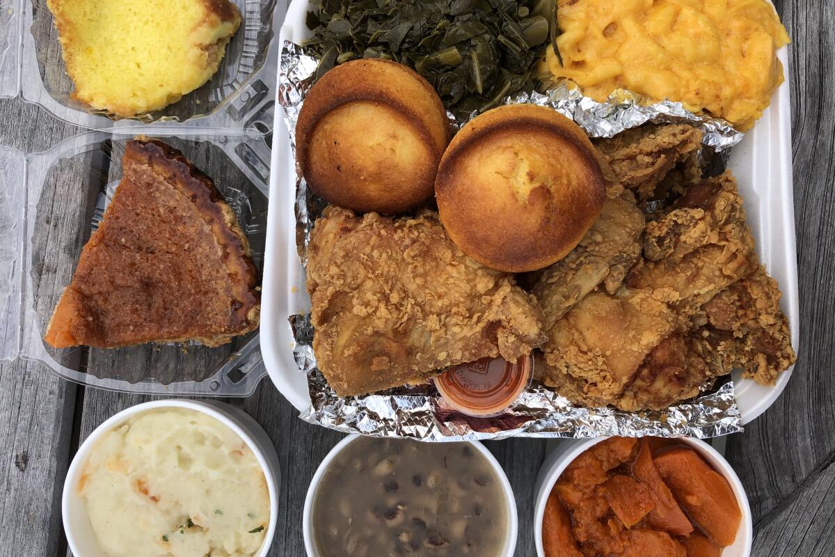 Fried chicken, collard greens, mac and cheese, black-eyed peas and a spread of other sides at Dulan's on Crenshaw.