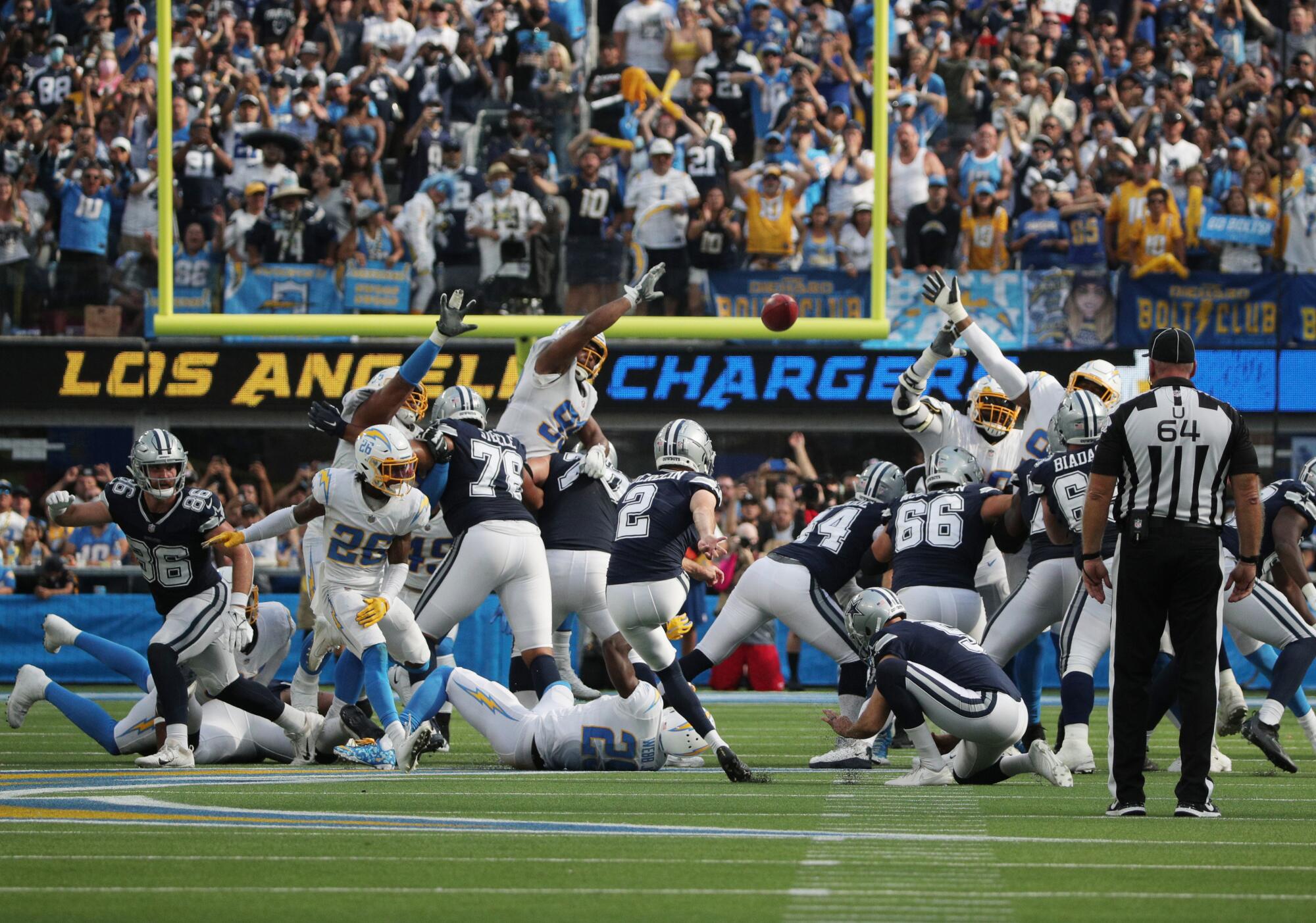 Greg Zuerlein kicks a 56- yard field goal as time expires to lift the Dallas Cowboys to victory over the Chargers.