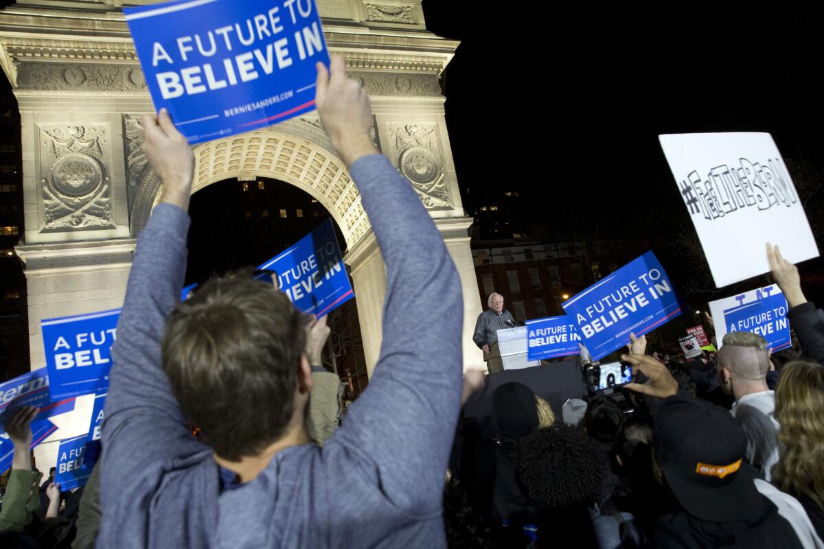 Supporters cheer as Democratic presidential candidate Bernie Sanders speaks during a rally Wednesday in New York.