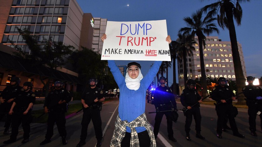 Aya Hilali joins the protest near Republican presidential candidate Donald Trump's rally in San Jose.