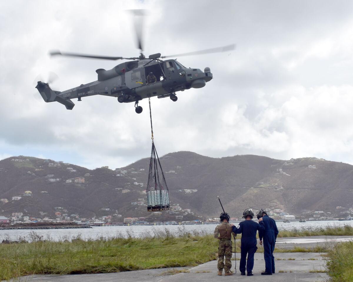 A handout picture released by the British Ministry of Defence (MOD) on Sept. 10, 2017, shows a helicopter from RFA Mounts Bay delivering aid in Tortola, British Virgin Islands on Sept. 9, 2017, during a relief operation following Hurricane Irma.